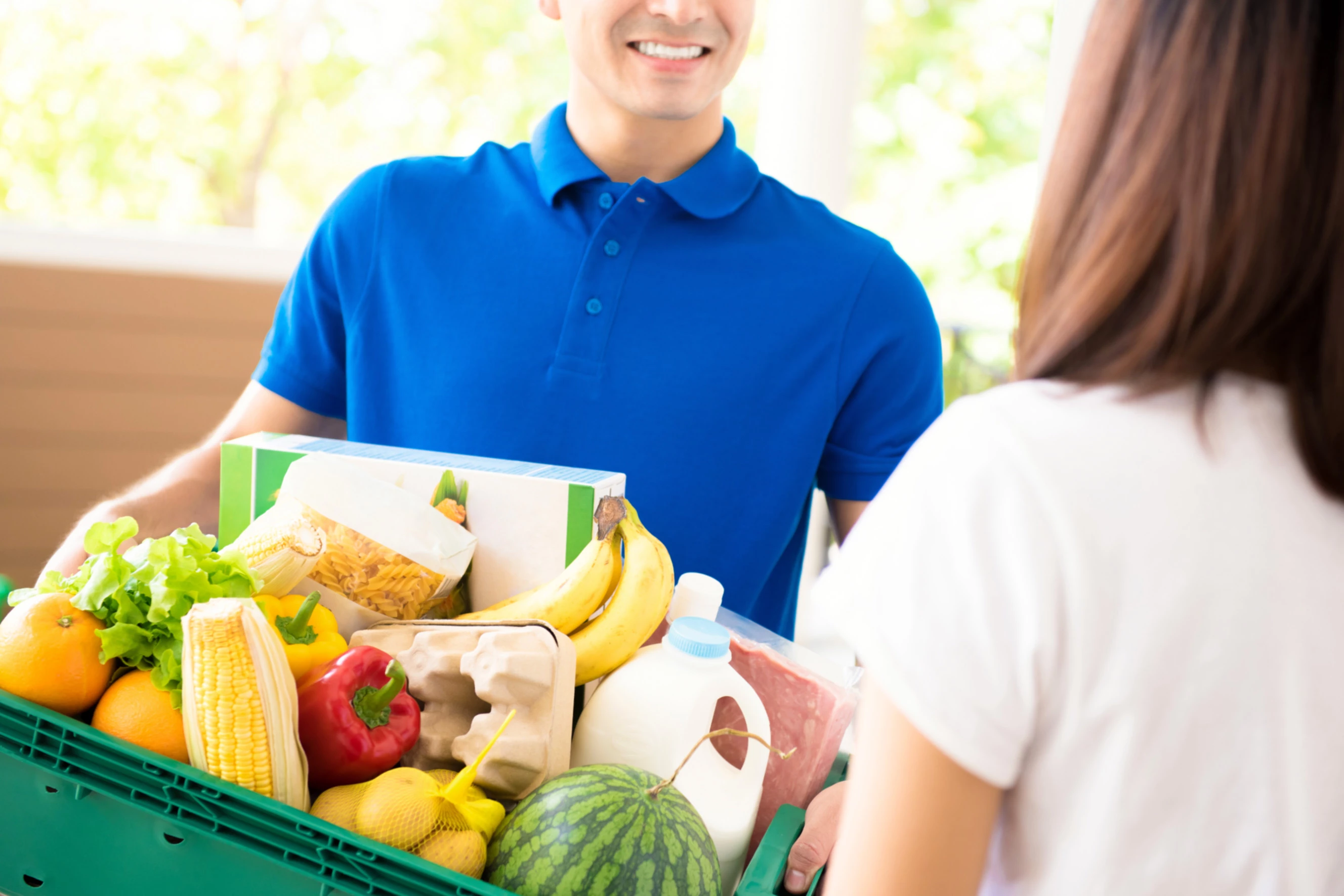 A grocery delivery at a customer's door